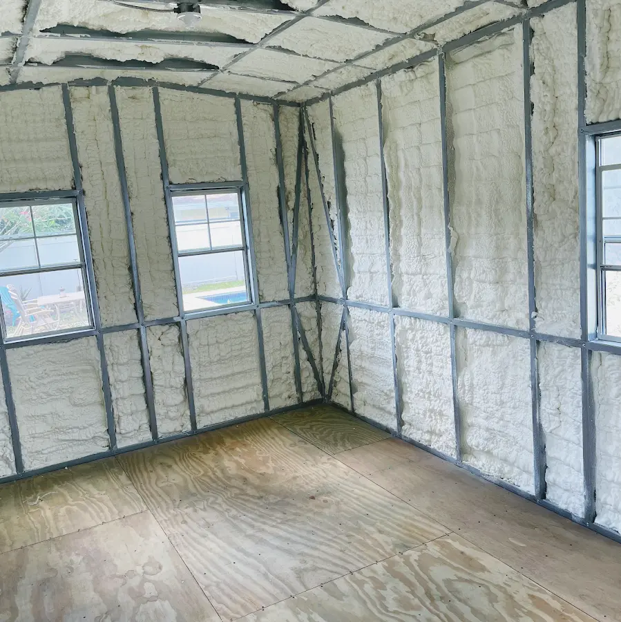 Closed-cell spray foam insulation applied to wall cavities in a residential project in Coral Springs